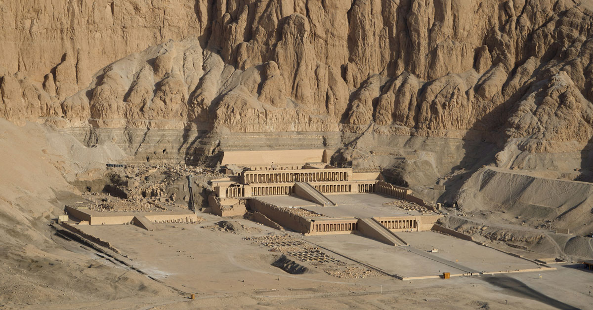 The Temple of Hatshepsut in Luxor is vast with rows of columns in a monument nestled into the mountainside in Luxor.